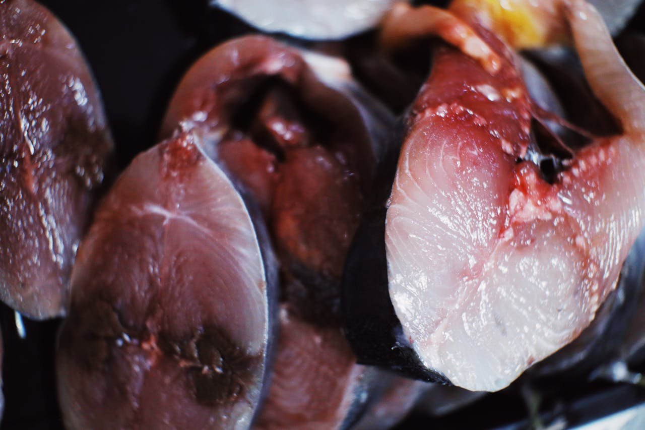High-angle view of fresh raw fish steaks, perfect for culinary preparation and healthy meals.